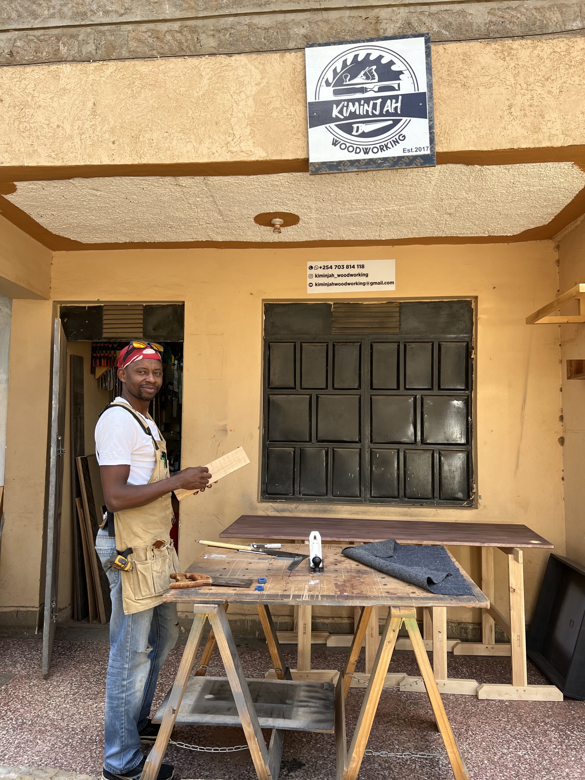 Collins Kiminjah outside his workshop